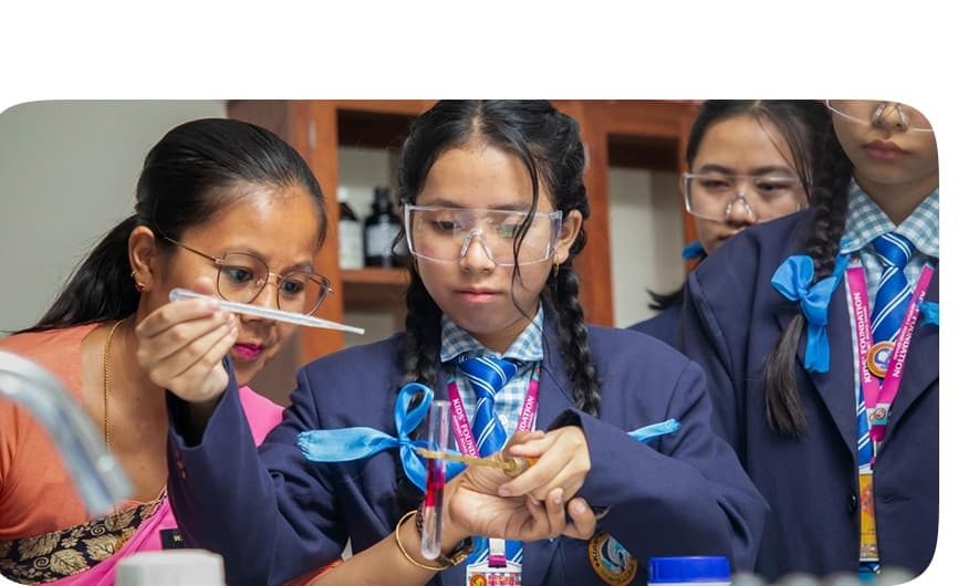 Students performing chemistry and biology experiments in the science lab